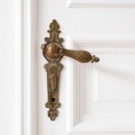 old door handle closeup on wooden door in beautiful apartment – interior